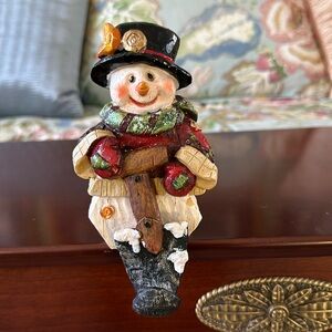Snowman stocking holder with crescent moon on top hat